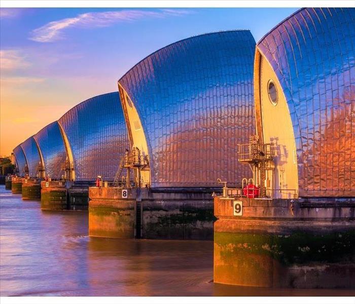 Thames Barrier, located downstream of central London at sunset